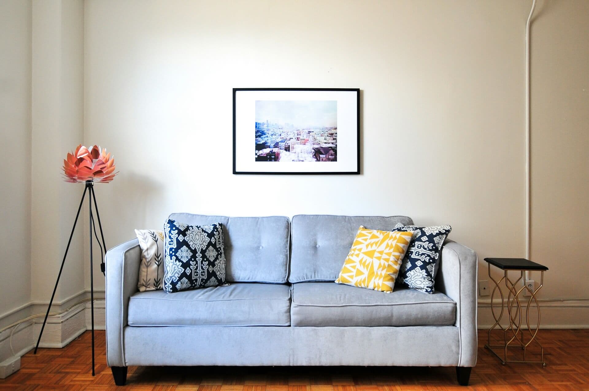 Before: living room with neutral lighting and minimal decor